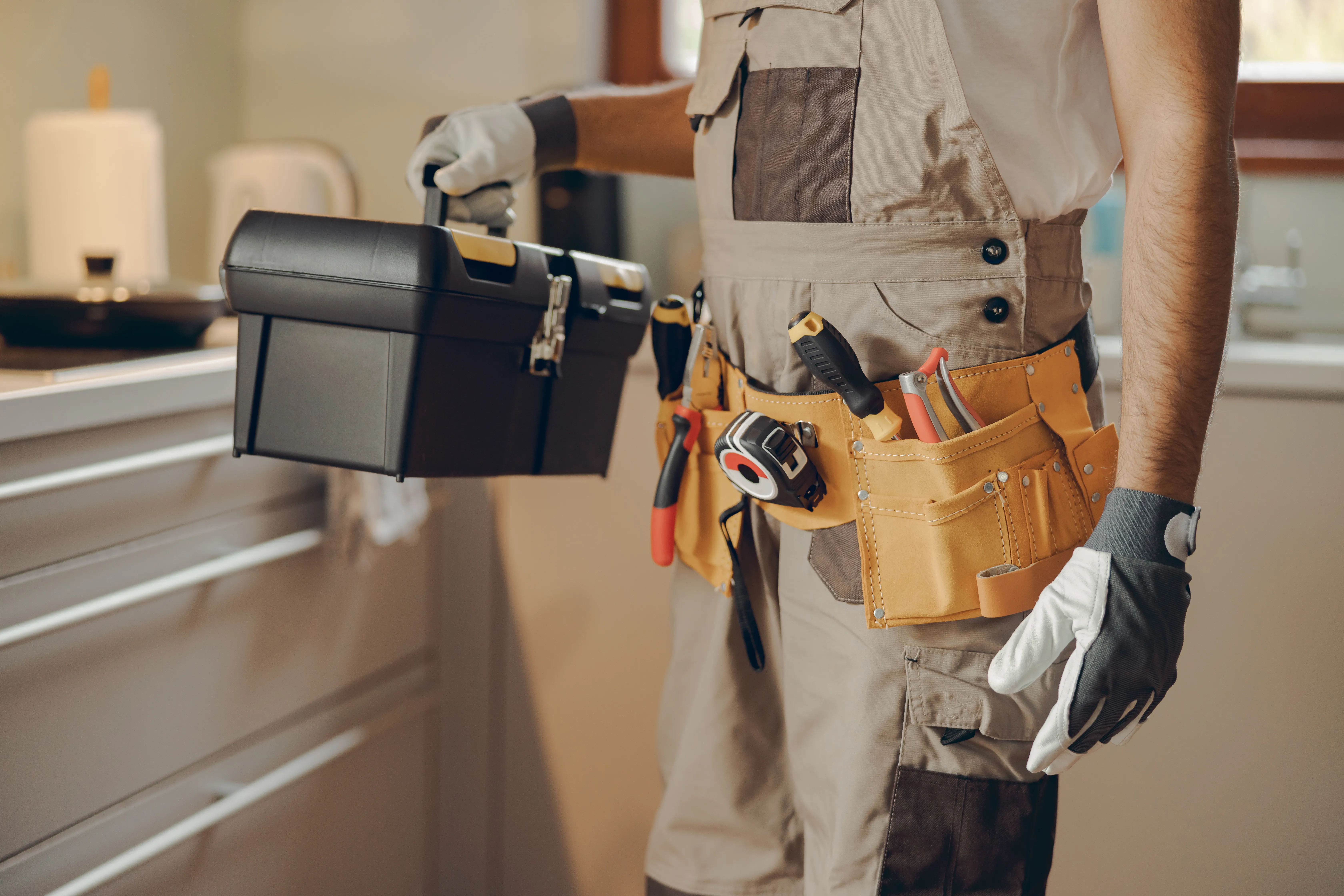 Technician standing with tool bag